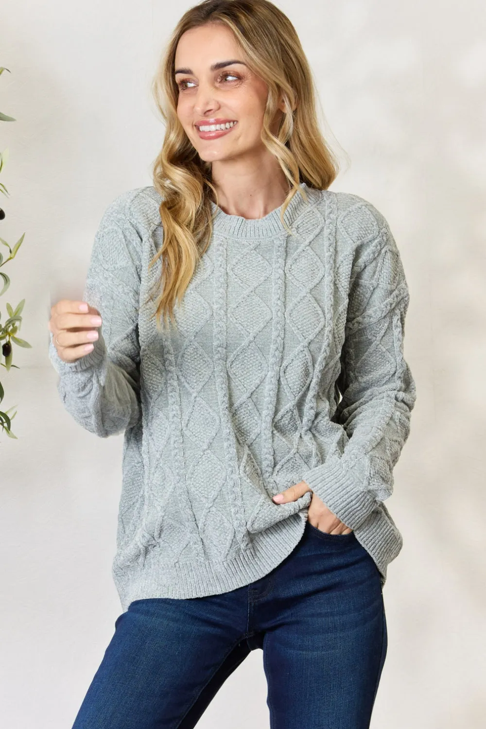 Pull col rond à motif torsadé