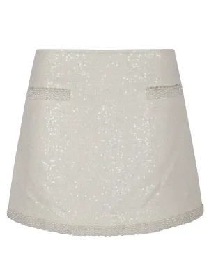 Jupe mini en bouclé crème avec garniture perle