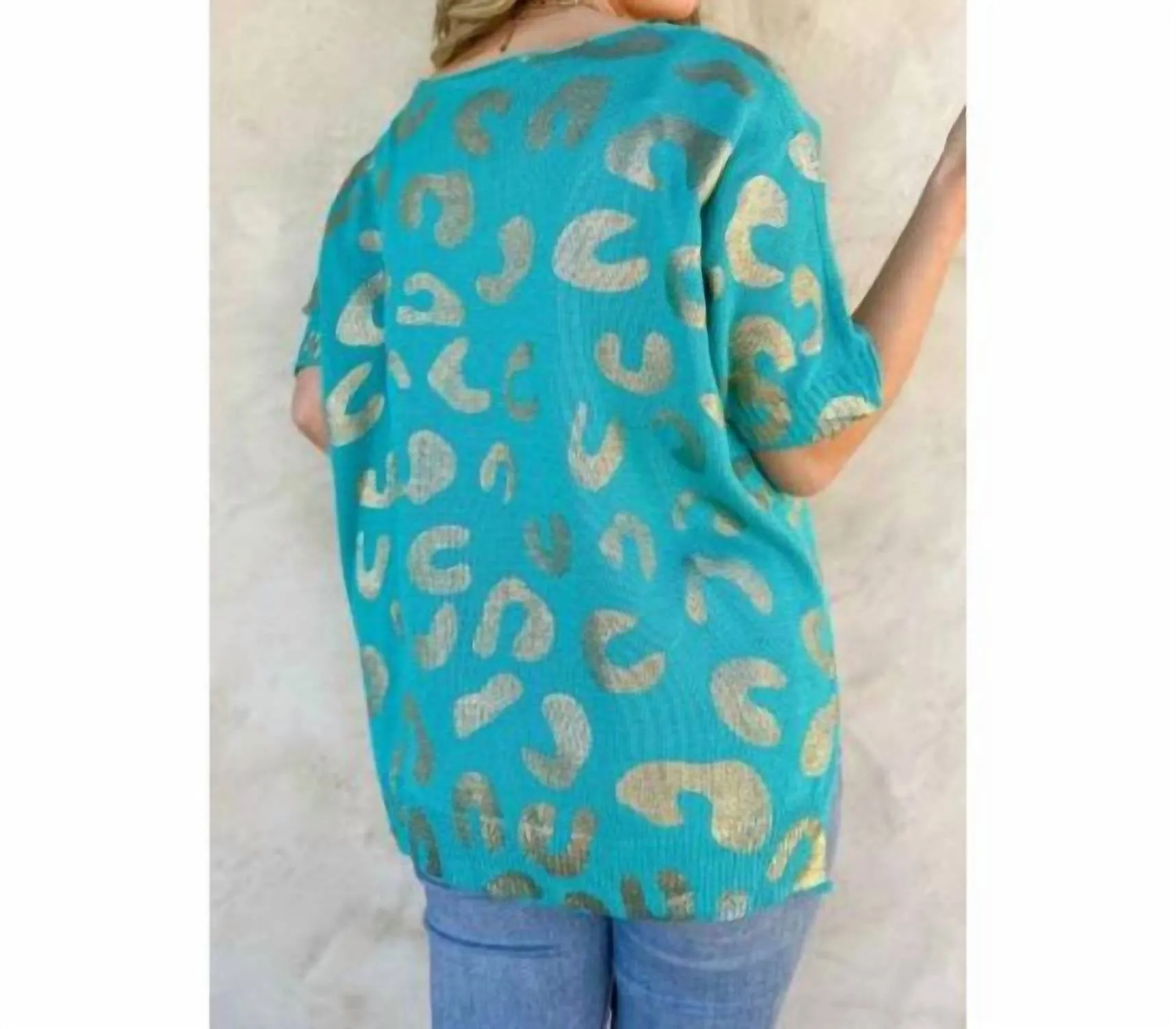 Haut en maille léopard turquoise et or