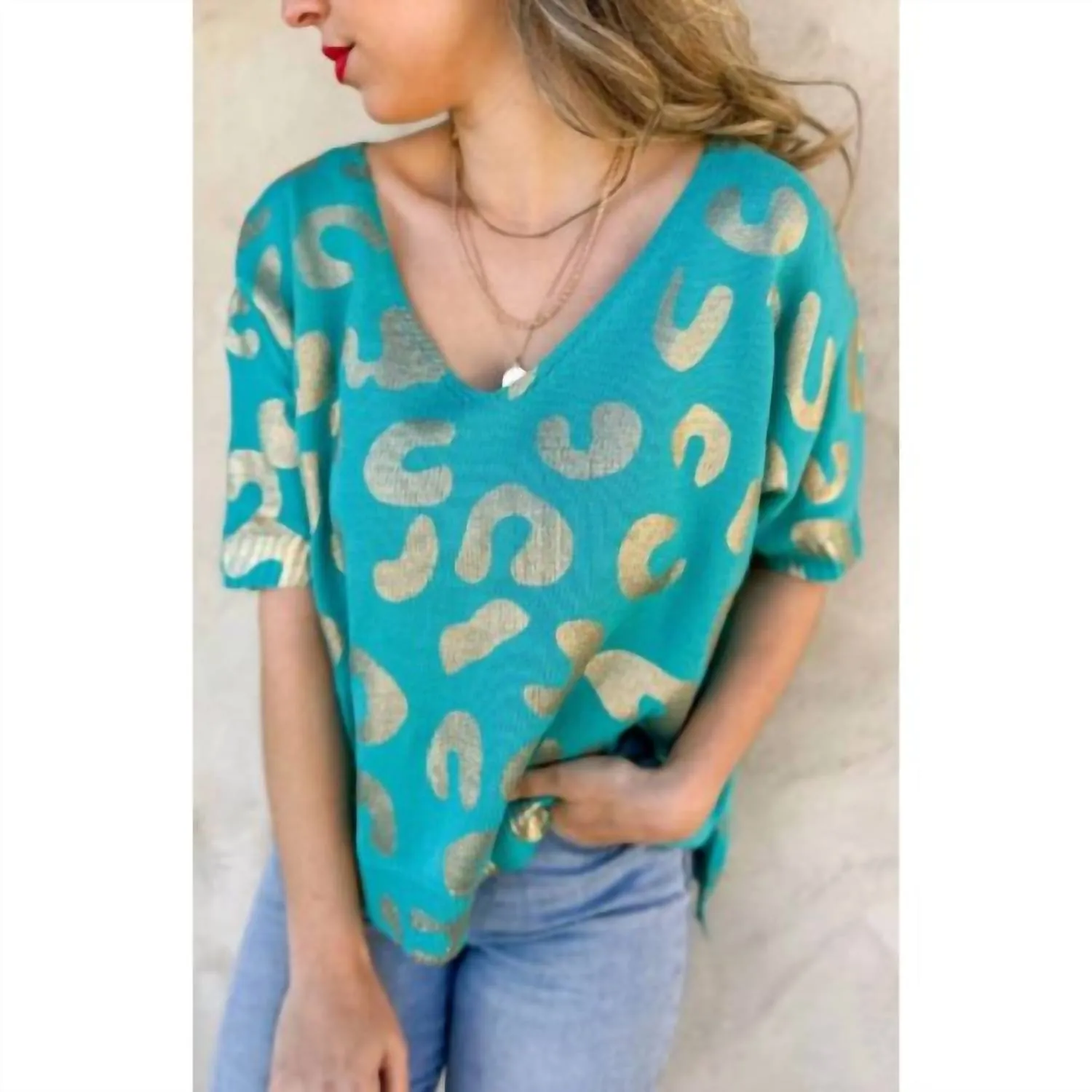Haut en maille léopard turquoise et or