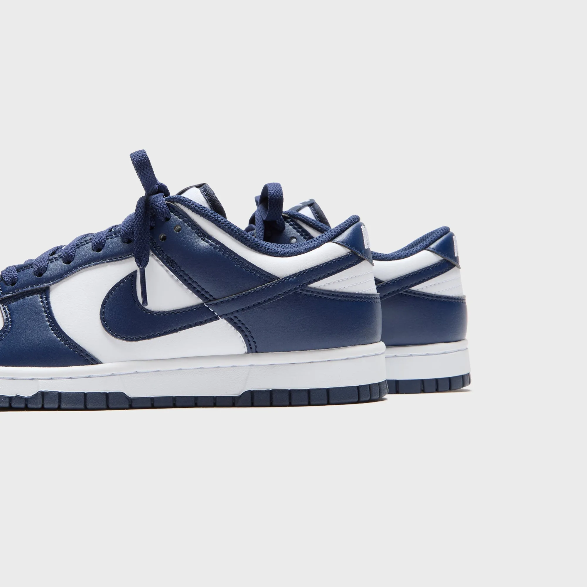Nike Dunk Low Retro - White / Midnight Navy / White Dress from the Feet Up Command Attention
