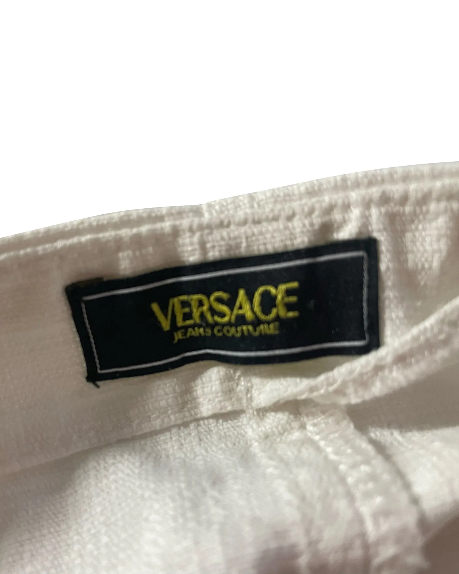 Jupe courte en coton écru Versace avec ceinture et détails œillets